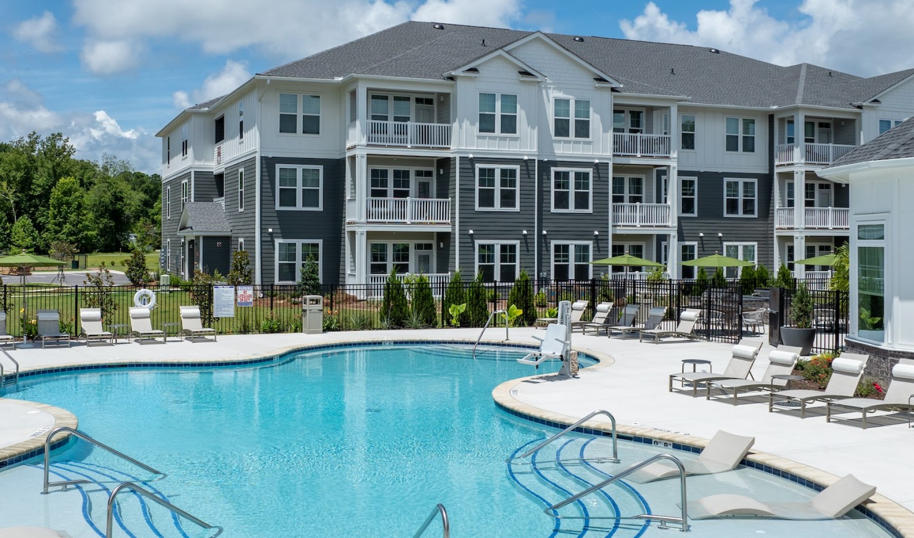 Pool with apartment complex  in the background